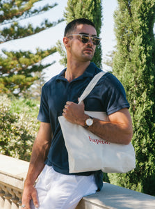 Terry towelling polo shirt in navy, accompanied with the Hapetote canvas tote bag